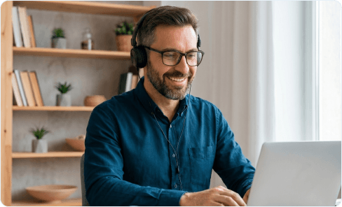 Support specialist with a headset assisting a client on a laptop