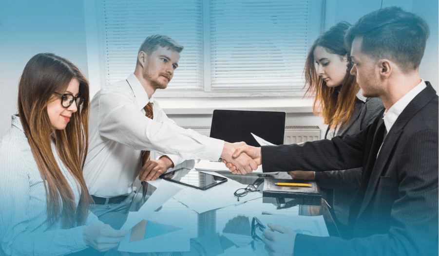 Business partners shaking hands after a successful agreement