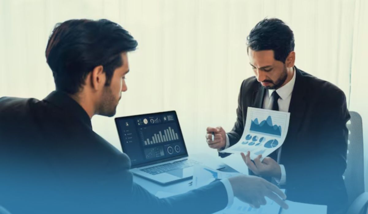Business professionals reviewing financial dashboards and reports